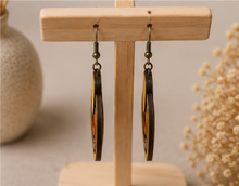 Load image into Gallery viewer, Side view of Earth Echoes wooden earrings showing the 2.5 mm wood thickness and layered construction.