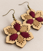 Load image into Gallery viewer, Close-up of hand embroidery and fine laser-engraved details on floral wooden earrings
