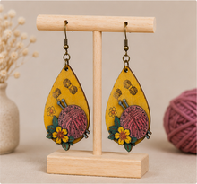 Load image into Gallery viewer, Hooked on Crochet wooden earrings displayed front-facing on a light wood stand.
