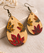 Load image into Gallery viewer, Close-up of Leaf Whispers hand-painted laser-engraved wooden earrings showing the dimensional leaf effect