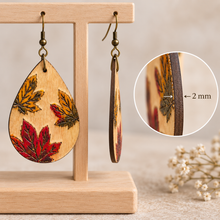 Load image into Gallery viewer, Side view of Leaf Whispers wooden earrings showing the single-piece 2 mm American linden wood construction