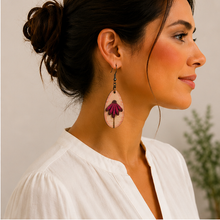 Load image into Gallery viewer, Mauve Blossom wooden earring worn with a warm ivory blouse, shown at a more realistic scale.