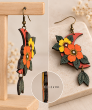 Load image into Gallery viewer, Moon Flower layered wooden earrings in side and angled views showing the 2 mm wood thickness and raised floral layers