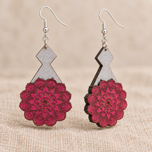 Load image into Gallery viewer, Close detail and angled view of Mystic Mandala Bloom layered wooden earrings highlighting the engraved magenta mandalas, hand-painted gray bases, visible wood edges and silver-tone hooks.