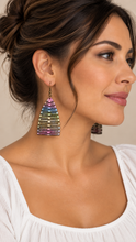 Load image into Gallery viewer, Model wearing Pearlescent Rainbow lightweight multicolor wooden earrings with a simple white top