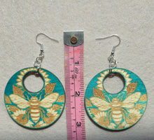 Load image into Gallery viewer, Bee &amp; Bloom – Turquoise Laser Engraved Wood Earrings with Sunflower &amp; Bee Design
