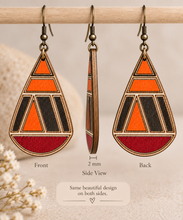 Load image into Gallery viewer, Geometric teardrop wooden earrings shown from the front, side and back, highlighting the same hand-painted design on both sides and the 2 mm American linden wood thickness.
