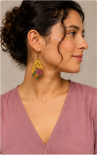 Load image into Gallery viewer, Model wearing Hooked on Crochet wooden earrings with a soft mauve top and hair pulled back.
