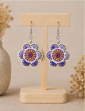 Load image into Gallery viewer, Lavender Bloom hand-embroidered wooden earrings displayed front-facing on a light wood stand.
