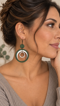 Load image into Gallery viewer, Model wearing Lunar Dance lightweight articulated wooden earrings with a soft mushroom warm greige top
