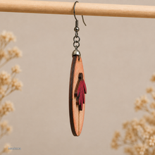 Load image into Gallery viewer, Side view of Mauve Blossom wooden earring showing the 2.5 mm wood thickness, raised layered petals, and double-sided construction.
