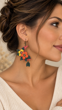 Load image into Gallery viewer, Model wearing Moon Flower lightweight layered wooden earrings with a soft cream top
