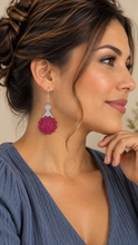 Load image into Gallery viewer, Model wearing a Mystic Mandala Bloom wooden earring with a soft slate-blue top, showing the approximately 2-inch layered earring at a natural scale.
