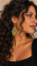 Load image into Gallery viewer, Model wearing Mystical Hamsa Hand lightweight wooden earrings with a black top
