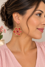 Load image into Gallery viewer, Model wearing Natural Splendor lightweight wooden flower earrings with red and pink hand embroidery and bronze-tone hooks
