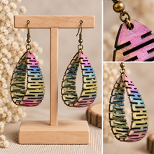 Load image into Gallery viewer, Pearlescent Rainbow wooden earrings shown in detailed angled views highlighting the curved open construction and hand-painted finish
